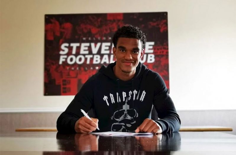 Defender Terence Vancooten is all smiles as he signs his new deal with League Two side Stevenage FC.