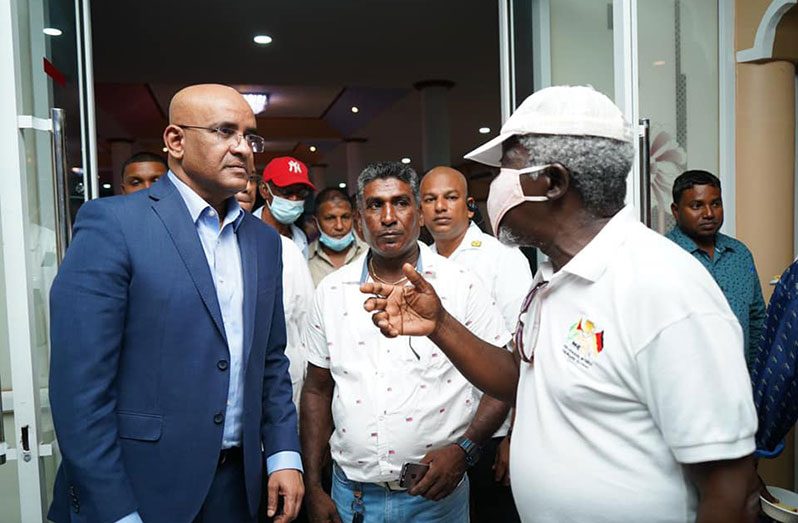 Vice-President, Dr Bharrat Jagdeo interacts with a member of the Region Six business community (DPI photo)