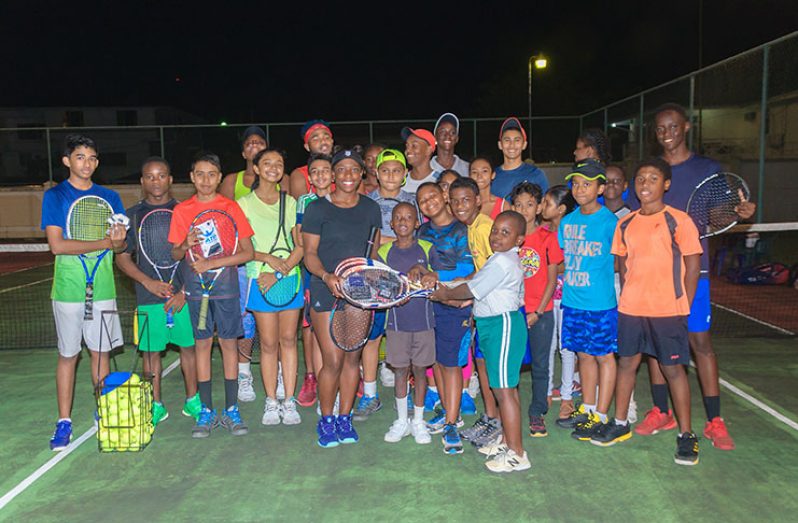 Sachia Vickery and players at the GBTI Tennis Courts where she presented tennis gear and other items. (Delano Williams)