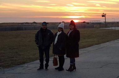 The family posing at Jone’s Beach in Long Island on a sunset evening