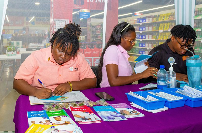 Registered Nurse, Latoya Bryan (left) with other health officials at Friday’s Outreach (Shaniece Bamfield photo)