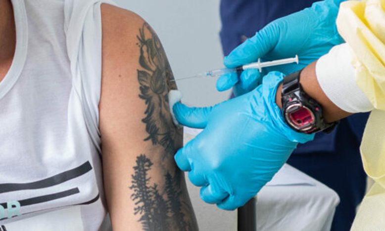An individual receiving a COVID-19 vaccine (Photo credit: Department of Public Information)