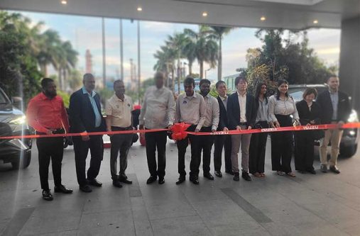 Officials and representatives from Marics and Isuzu participate in the ribbon-cutting ceremony to mark the re-introduction of Isuzu vehicles to Guyana