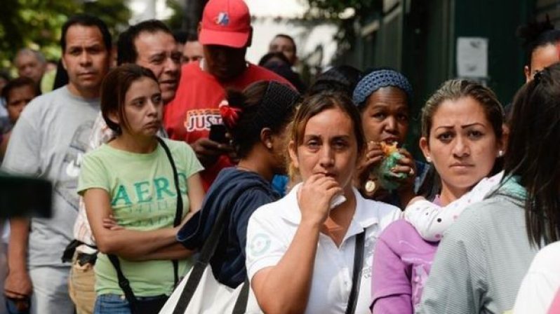 Venezuelans have grown accustomed to having to queue for hours to get some of their daily staples. [Photo taken from BBC]