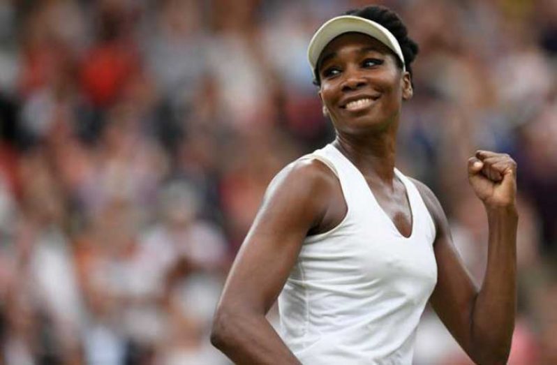 Venus Williams of the U.S. celebrates winning the quarter-final match against Latvia’s Jelena Ostapenko. (REUTERS/Tony O'Brien)