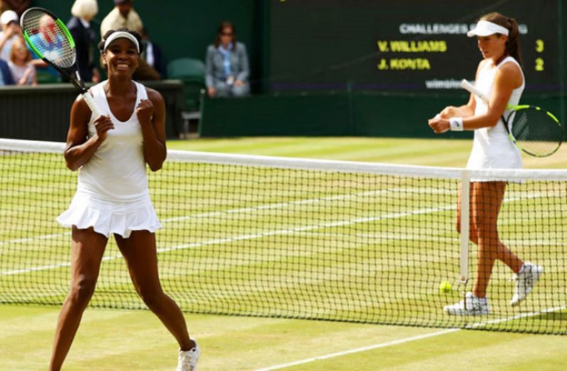 Venus Williams of the United States celebrates as Johanna Konta of Great Britain looks dejected during the Ladies’ Singles semifinal match. (Photograph: Clive Brunskill/Getty Images)
