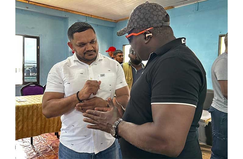 Minister of Natural Resources, Vickram Bharrat in discussion with one of the many residents on practical recommendations