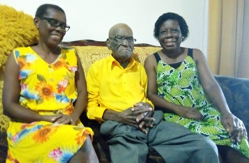 Centenarian Mr. Victor Lewis with his two daughters, Brenda and Patricia at his Brighton home on Wednesday