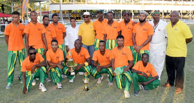 The victorious Rose Hall Town Gizmos and Gadgets team, strike a pose with the trophy, after defeating Albion in the final. Fifth from left is General Manager of Bakewell, Rajin Ganga, while on his left is Managing Director of NAMILCO, Bert Sukhai.