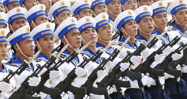 Sailors hold Israeli-made Galil riffles while marching during a celebration to mark National Day at Ba Dinh square in Hanoi September 2, 2015. Photo taken September 2, 2015. REUTERS/Kham