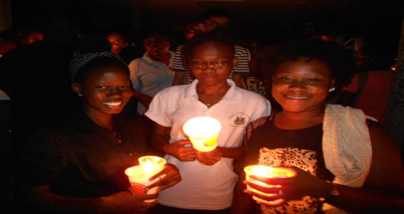 Students and staff who assembled in front of the ELT with their candles to mourn “ dying university.” (Photo compliments of Splash )