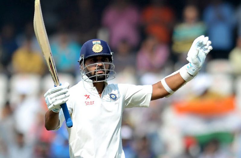 M. Vijay celebrates after reaching his ninth Test hundred against Bangladesh in Hyderabad.