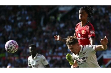Arsenal striker, Viktor Gyokeres and Manchester United defender, Leny Yoro, tussle for possession at Old Trafford