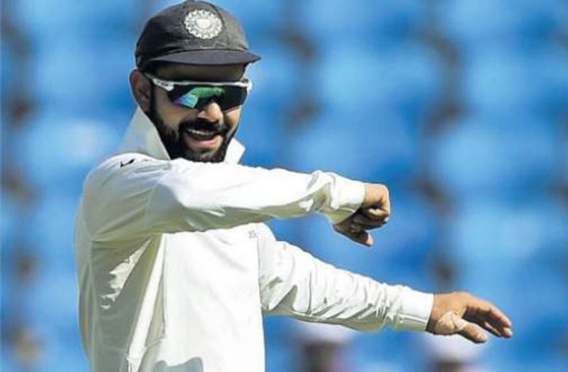 Indian cricket team captain Virat Kohli gestures during the fourth day of the second Test match against Sri Lanka, at the Vidarbha Cricket Association Stadium in Nagpur on Monday. (Photo: AFP)