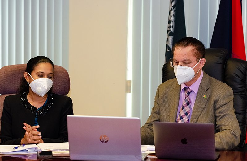 Security Adviser to the Minister of Home Affairs, Harry Gill and Home Affairs Ministry Research Officer, Kavita Bhowani during the virtual meeting with CARICOM Implementation Agency for Crime and Security (Delano Williams photo)