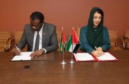 Minister of Foreign Affairs and International Cooperation Hugh Todd, and UAE’s Minister of State for International Cooperation Reem Al Hashimy signing the MoU