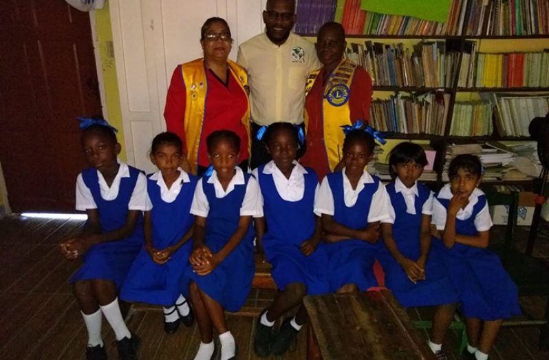 The ‘vision screening’ team at Graham’s Hall Primary on Monday. Standing from left are: Lions Services for Children’s Ambika Singh; District Governor Anwar Hollingsworth; and Global Service Team Coordinator, Wavney Setal