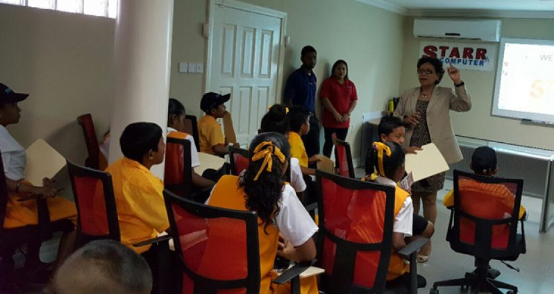 Minister within the Ministry of Indigenous People’s Affairs, Valerie Garrido-Lowe addressing Baramita students during an informative session at STARR Computer, recently