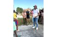 Minister Jacobs (front), Assistant Director of Sport Franklin Wilson (partly hidden by the minister), meet with the residents of West Ruimveldt on Saturday.