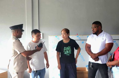 Divisional Commander, Assistant Commissioner Shivpersaud Bacchus speaks with the family of Chinese national Chen Yong Ping, who was recently murdered during a robbery at his home in Cumberland Village, East Canje, Berbice