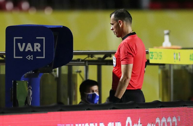 FIFA World Cup 2022 South American Qualifiers - Brazil v Venezuela - Estadio Morumbi, Sao Paulo, Brazil - November 13, 2020 Referee Juan Gabriel Benitez refers to VAR Fernando Bizerra/Pool via REUTERS