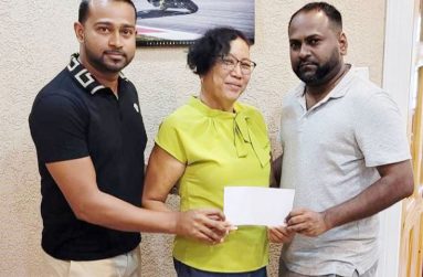 Mr Badesh Thakur, one of the Managing Directors. hands over the cheque