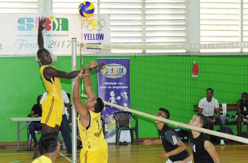 Renaldo Bobb goes up for one of his many spikes during Guyana's win over Suriname last evening in Paramaribo. (Delano Williams photo)