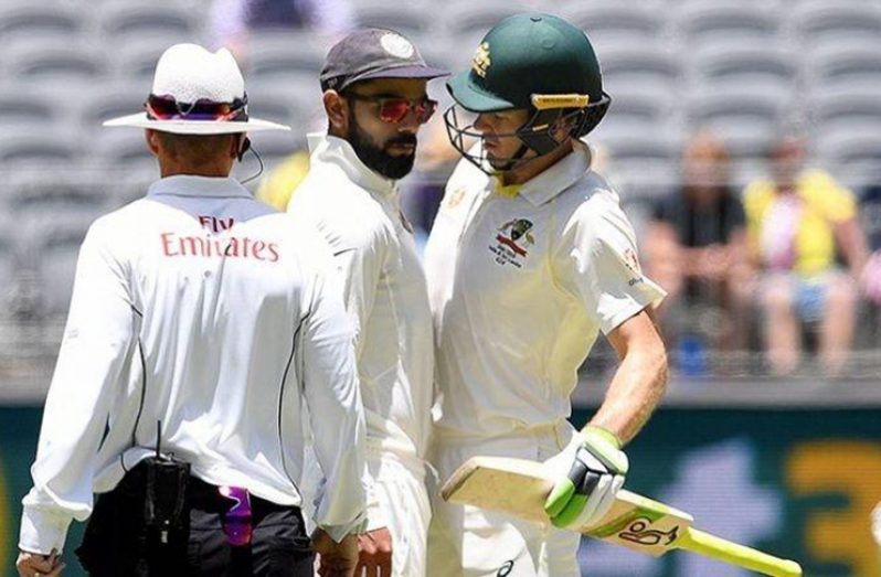 Virat Kohli (left) and Tim Paine exchanged verbal volleys on Day 3 of the second Test between India and Australia.