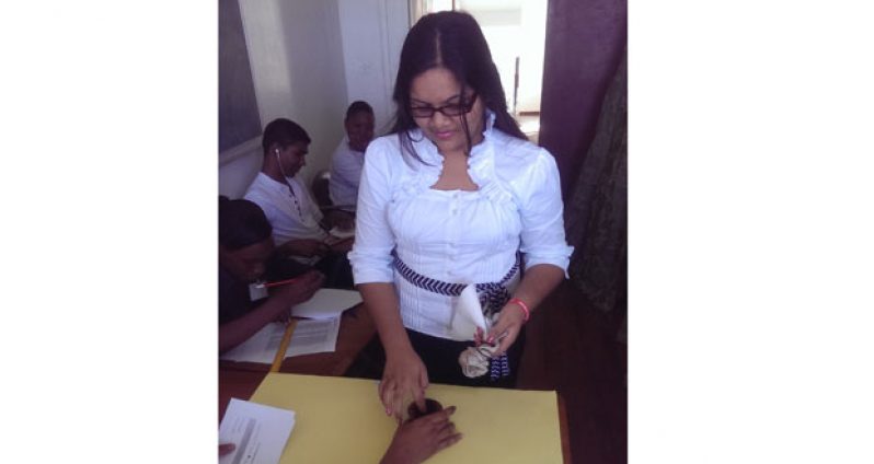 One of the law students inking her finger during the voting process Tuesday