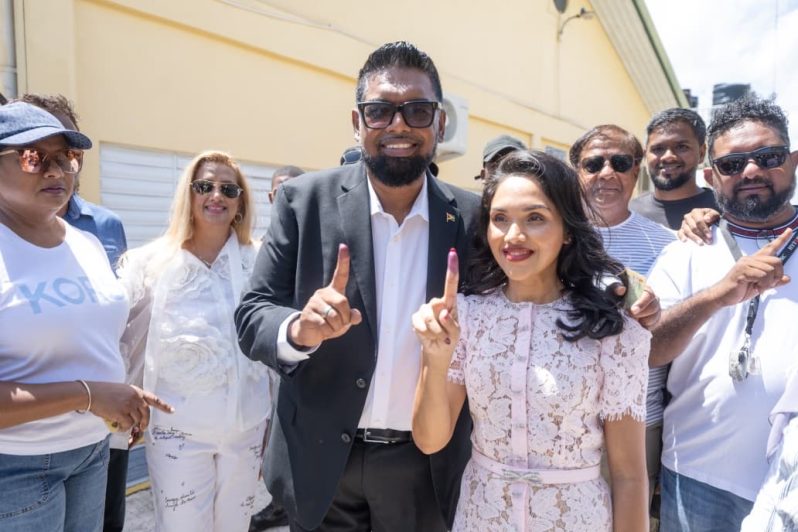 President Ali and First Lady Arya Ali show their ink-stained fingers after voting (DPI)
