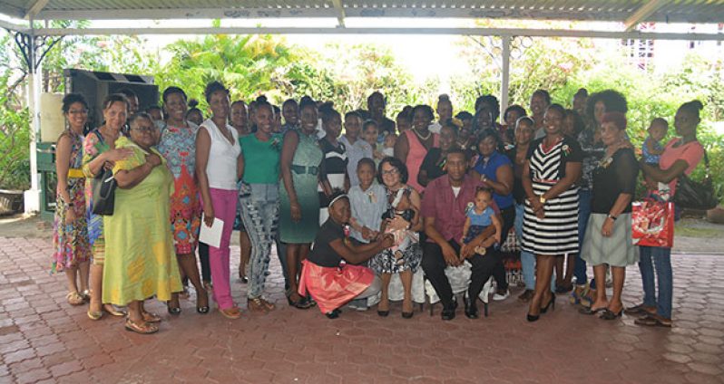 First Lady Mrs. Sandra Granger with donors, volunteers and beneficiaries from the Women Across Differences programme for adolescent mothers at the Georgetown Club