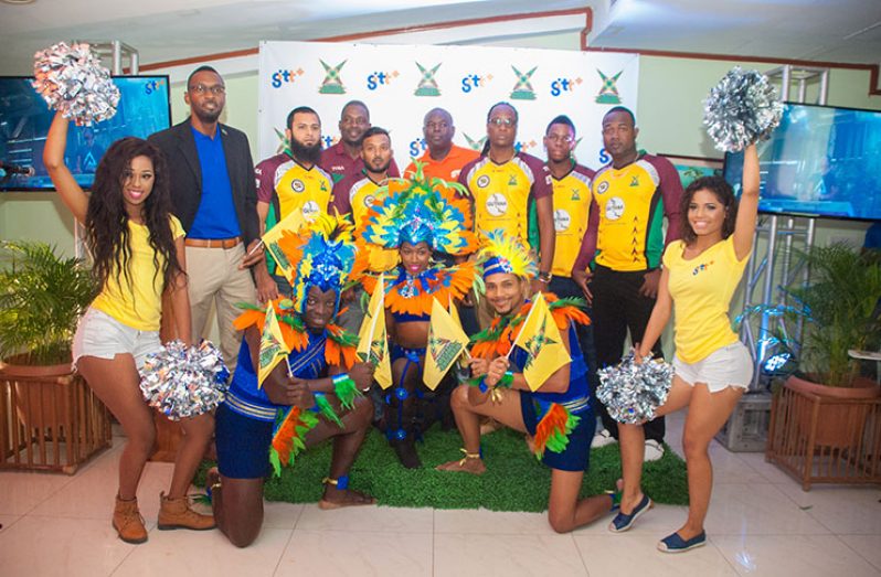 Director of Sport Christopher Jones (first from left) and GTT’s CEO Justin Nedd are joined by some members of the Guyana Amazon Warriors and revellers at the signing event yesterday.