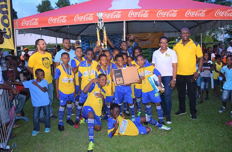 CHAMPS! West Ruimveldt Primary School after winning this year’s COURTS Pee Wee Football tournament, having defeated Marian Academy 4 – 0 in the final at Thirst Park on Saturday.