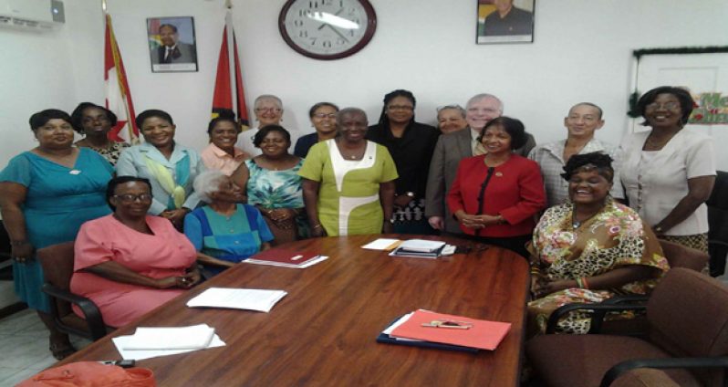 Women and Gender Equality Commission Chairperson Indra Chandarpal (second, right standing) and Canadian High Commissioner Pierre Giroux (just behind Chandarpal) with staff of the Human Rights Secretariat in Queenstown, Georgetown