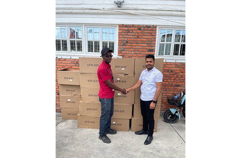 Principal Assistant Secretary (General), at MHSSS, Mr. Seebaran (right) receiving the donations on Tuesday