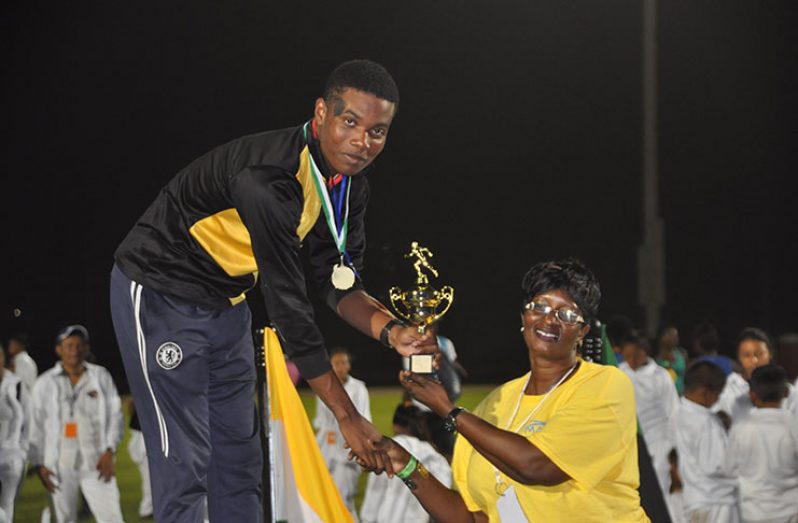 Daniel Williams receives his U-18 Champion Boy trophy. (Delano Williams photo)