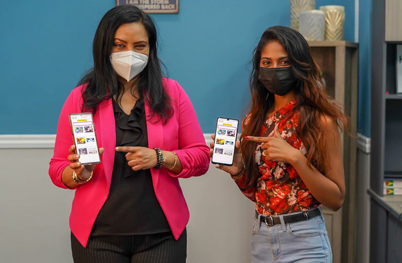Minister of Human Services and Social Security, Dr. Vindhya Persaud (left) and B Socially Intact founder, Brittany Singh exhibits the WiiN App