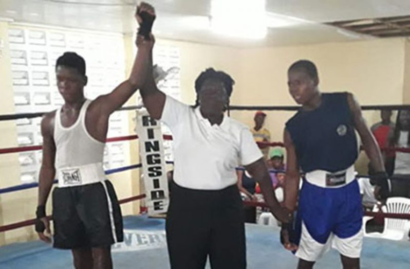 FLASHBACK! Referee Paulette Nurse raises the hand of FYF member Richard Howard following his victory over Travis Inverary. He was later named ‘Best Boxer’ of the tournament.