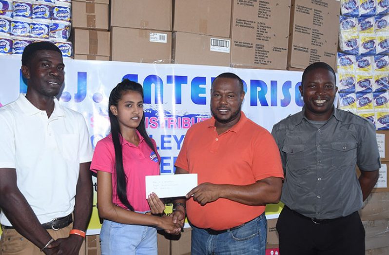WJ Enterprise’s Kavita Sookhu presents the sponsorship cheque to Petra co-Director Troy Mendonca in the presence of Sean Embrack and Mark Alleyne.