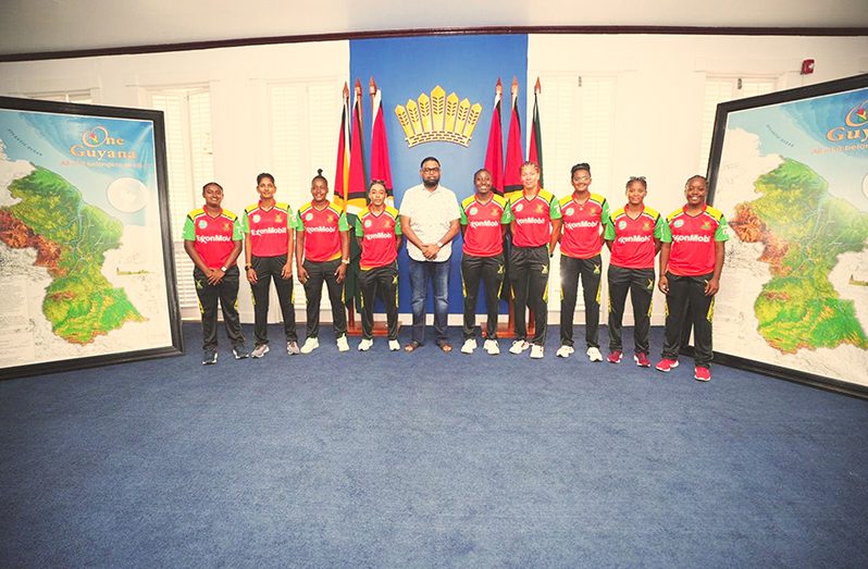 President Dr. Irfaan Ali and some of the members of the Guyana Amazon Warriors Women’s team