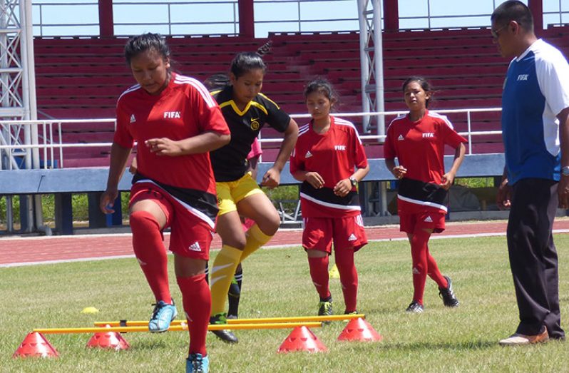 Some women go through drills at the CONCACAF Football Day event.