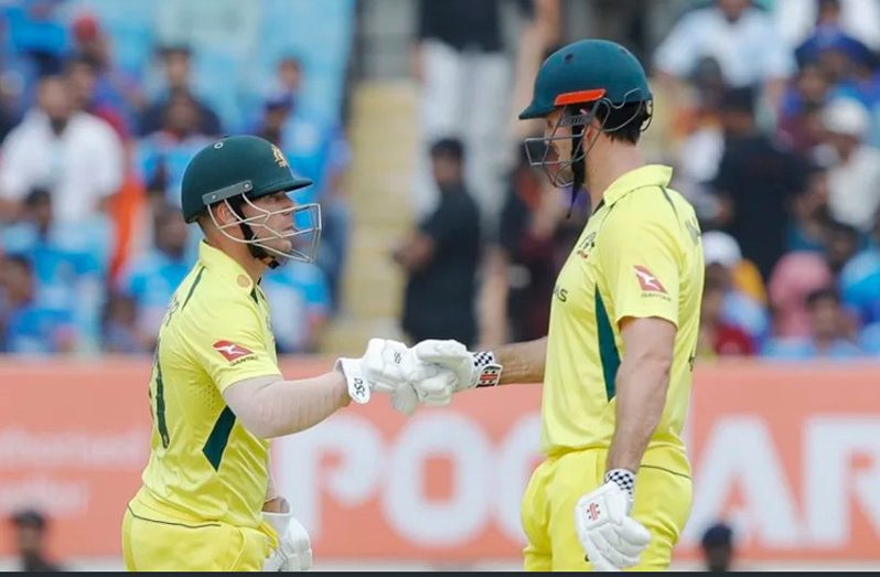David Warner and Mitchell Marsh show some glove-love after giving Australia a rollicking start•BCCI