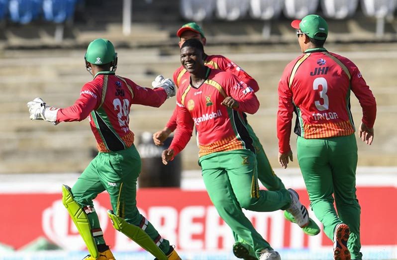 Jubilant Amazon Warriors players celebrate after recording a dramatic 14-run win over the Jamaica Tallawahs.(CPL photo)