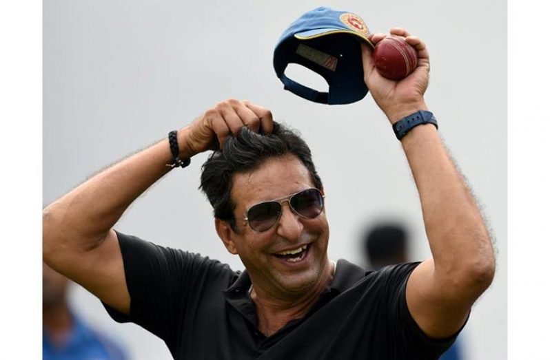 Wasim Akram says being unable to polish the ball with saliva could turn bowlers into robots, but that cricketers should live with it (AFP Photo/Ishara S. KODIKARA)