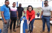 Minister within the Ministry of Housing and Water Susan Rodrigues testing the water supply at the newly commissioned $26.5M water supply system in Taruka, Region Eight