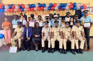 Deputy Commissioner ‘Administration’, Mr. Ravindradat Budhram (seated centre) next to divisional commander, Superintendent Guy Nurse, Traffic Chief, Senior Superintendent Mahendra Singh and other officials flanked by the awardees