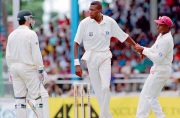 FLASHBACK: Steve Waugh and Curtly  Ambrose go toe-to-toe .Ambrose raged closer to Waugh, who stood his ground as the Trinidad  crowd seethed, until West Indian captain Richie Richardson stepped in to drag Ambrose away - a scene depicted in what is now one of the most famous photographs in Australian cricket.(AAP)