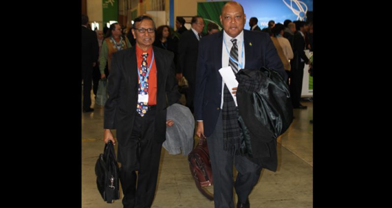Guyana’s lead climate negotiator Andrew Bishop and Minister of Governance Raphael Trotman.