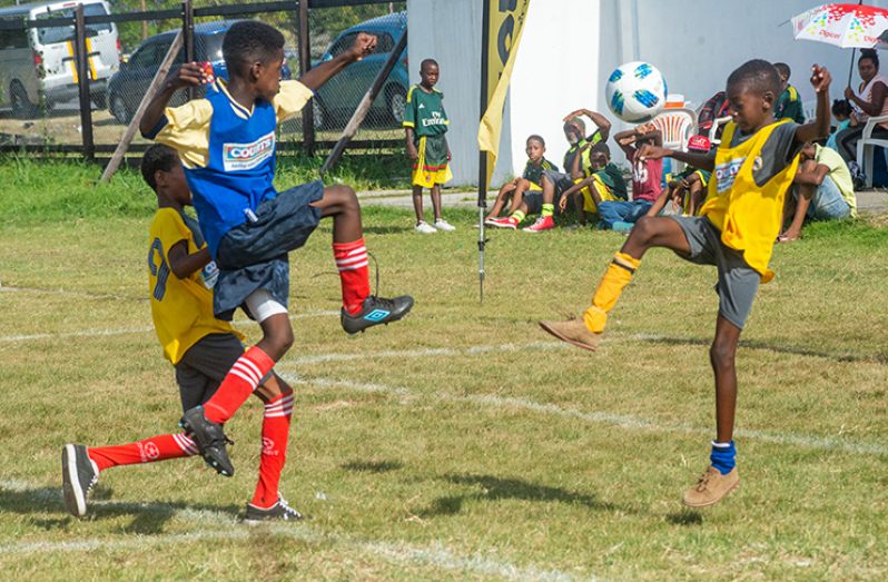 Part of the action in the COURTS Pee Wee football tournament between Marian Academy and BV. (Delano Williams photo)