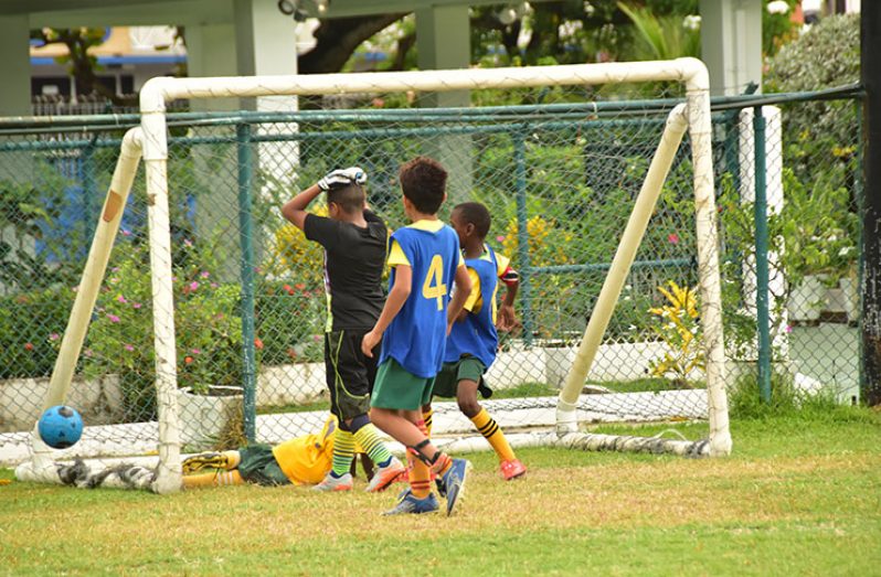 This Adrian Narine Photo shows a goalkeeper holding his head after he is beaten during one of the matches yesterday at thirst Park.